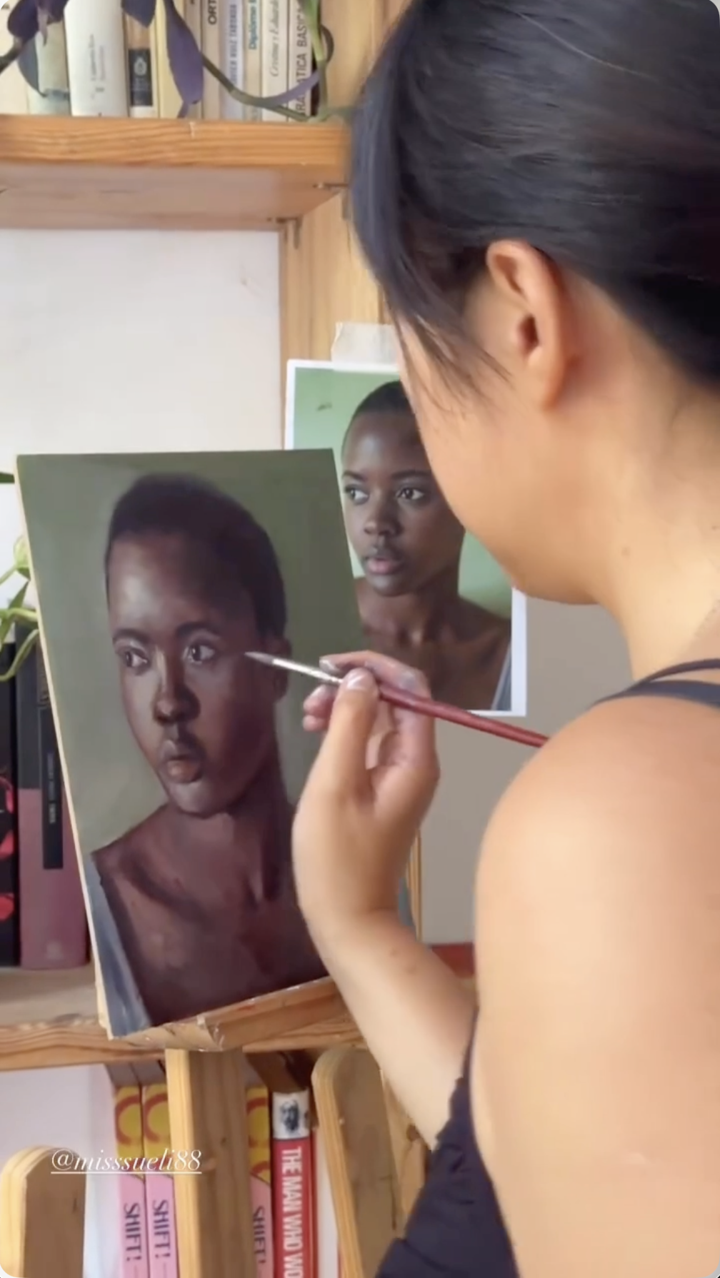 Susana Li painting in her studio